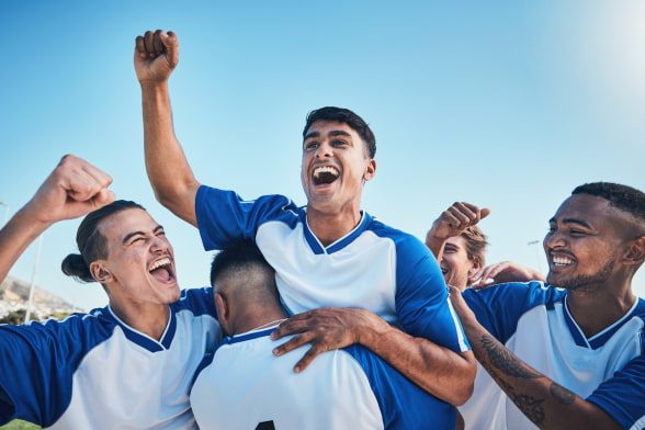 teammates cheer after winning a game